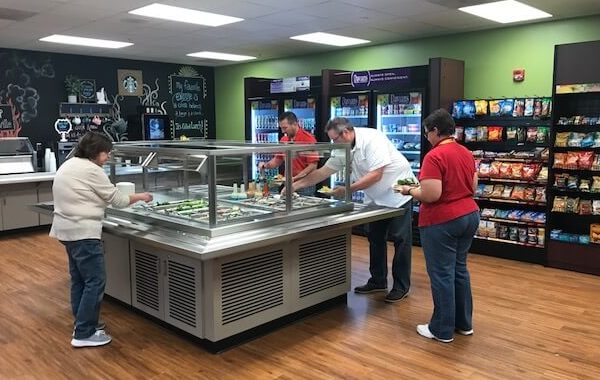 Customers filling up on healthy options from the salad bar with Davians Micro Markets