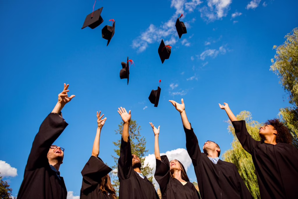 Graduation hats being thrown